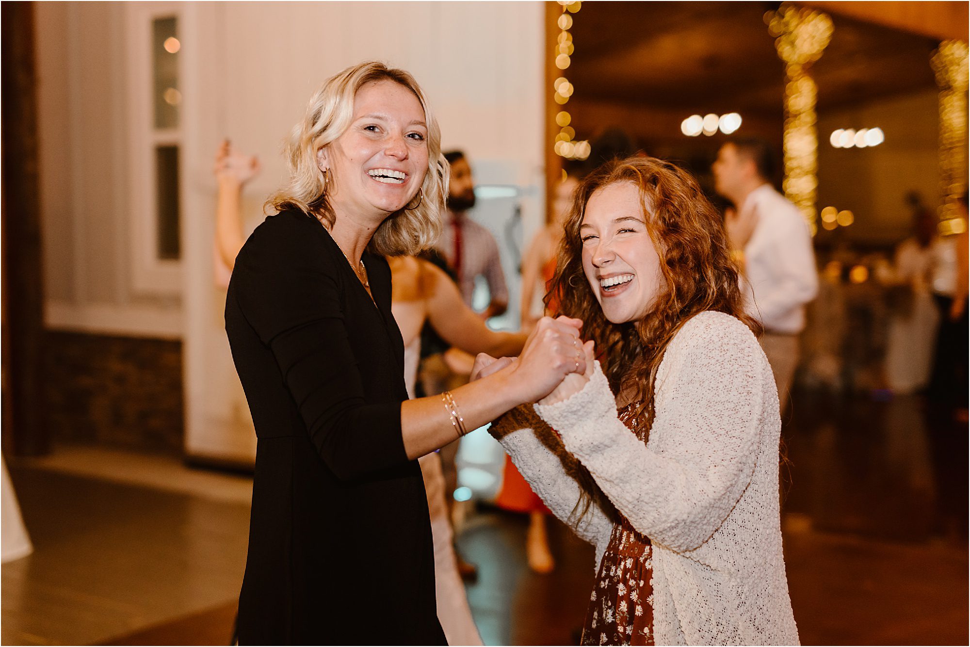 guests enjoying dance floor at wedding reception
