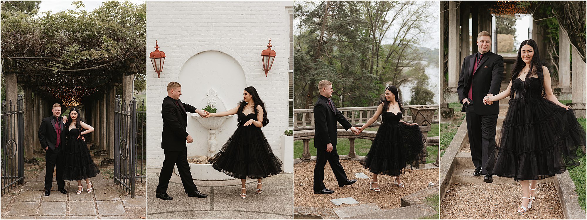 A couple poses in formal attire at an outdoor location reminiscent of Bleak House. The man wears a black suit and burgundy shirt, the woman a striking black dress. They walk hand in hand, capturing moments akin to elegant family photos near a white wall and lush greenery.