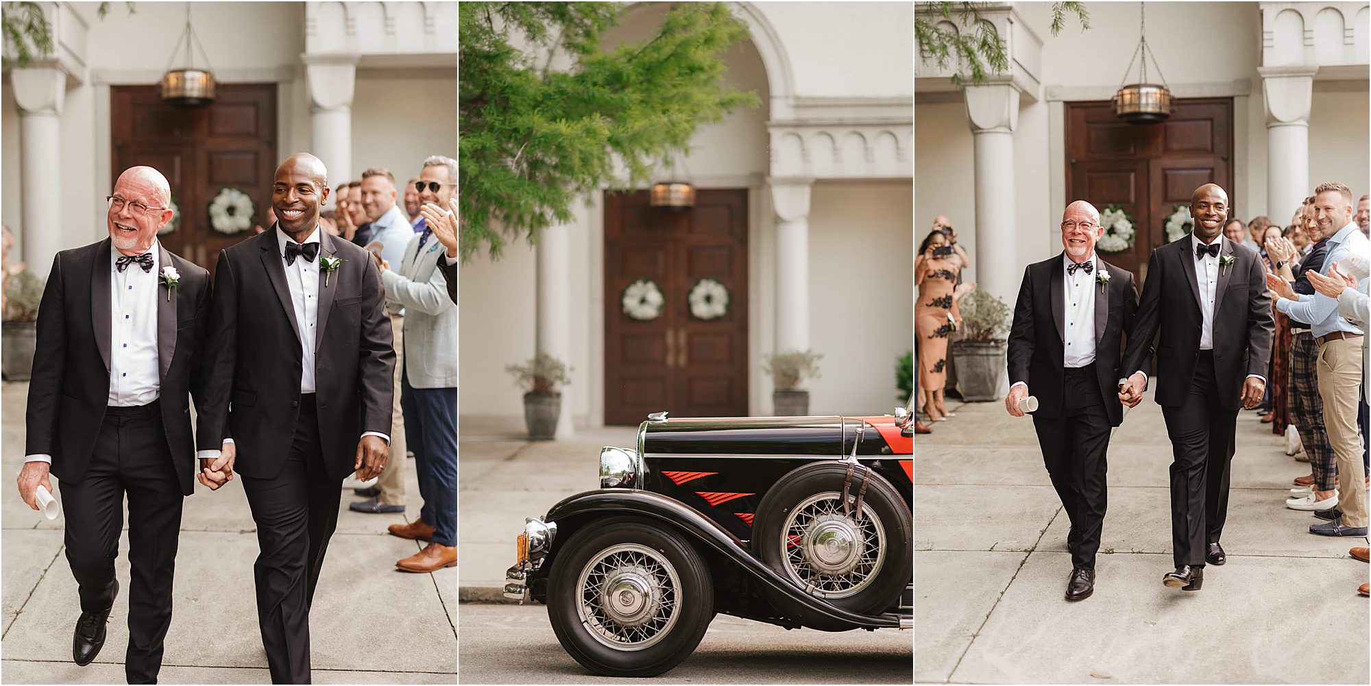 Two grooms in tuxedos hold hands and smile while walking outside a Knoxville church wedding, greeted by applauding guests. An antique car is parked in front of the entrance.